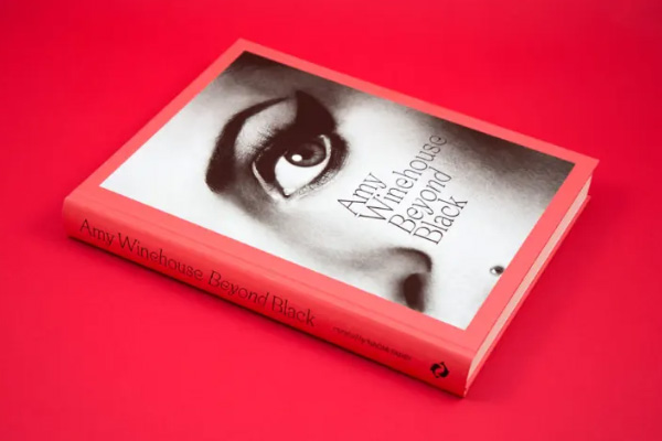 Gwen Stefani in an office elevator in the middle of two generic office employees